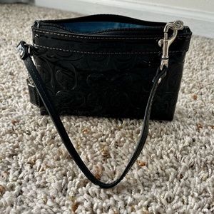 Coach black wristlet. It’s in prestige condition, barely used. Smoke free home.